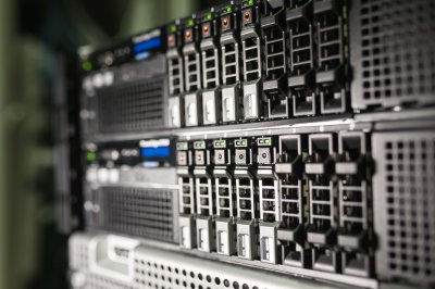 Multiple server towers or computer equipment arranged to show networked connections, illustrating distributed computing infrastructure